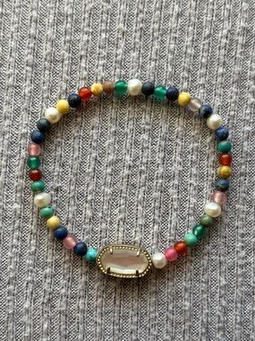 Multicolor stone, bead & faux pearl stretch bracelet w center gold tone charm